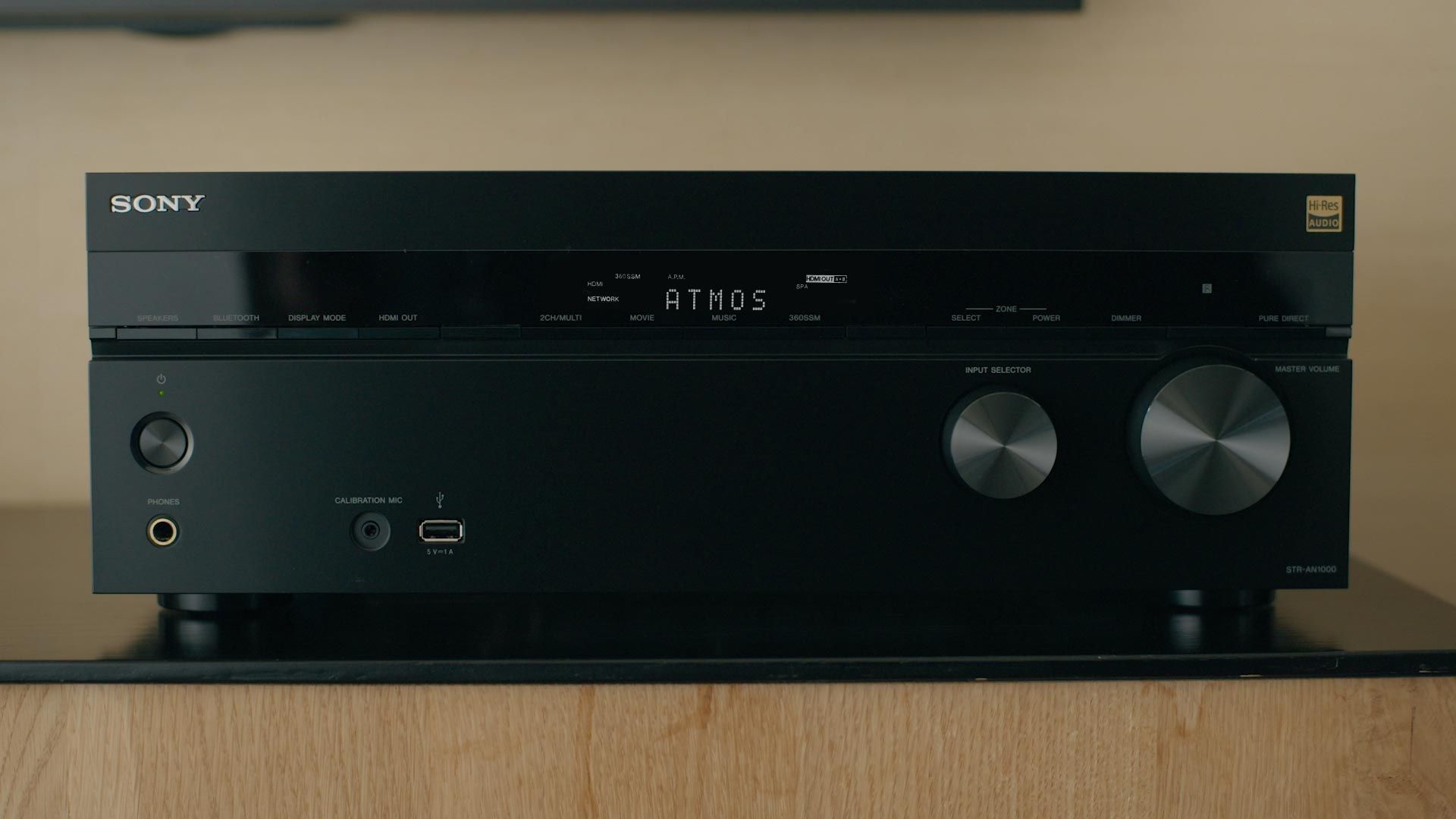 Sleek Sony receiver with dual knobs and Atmos display